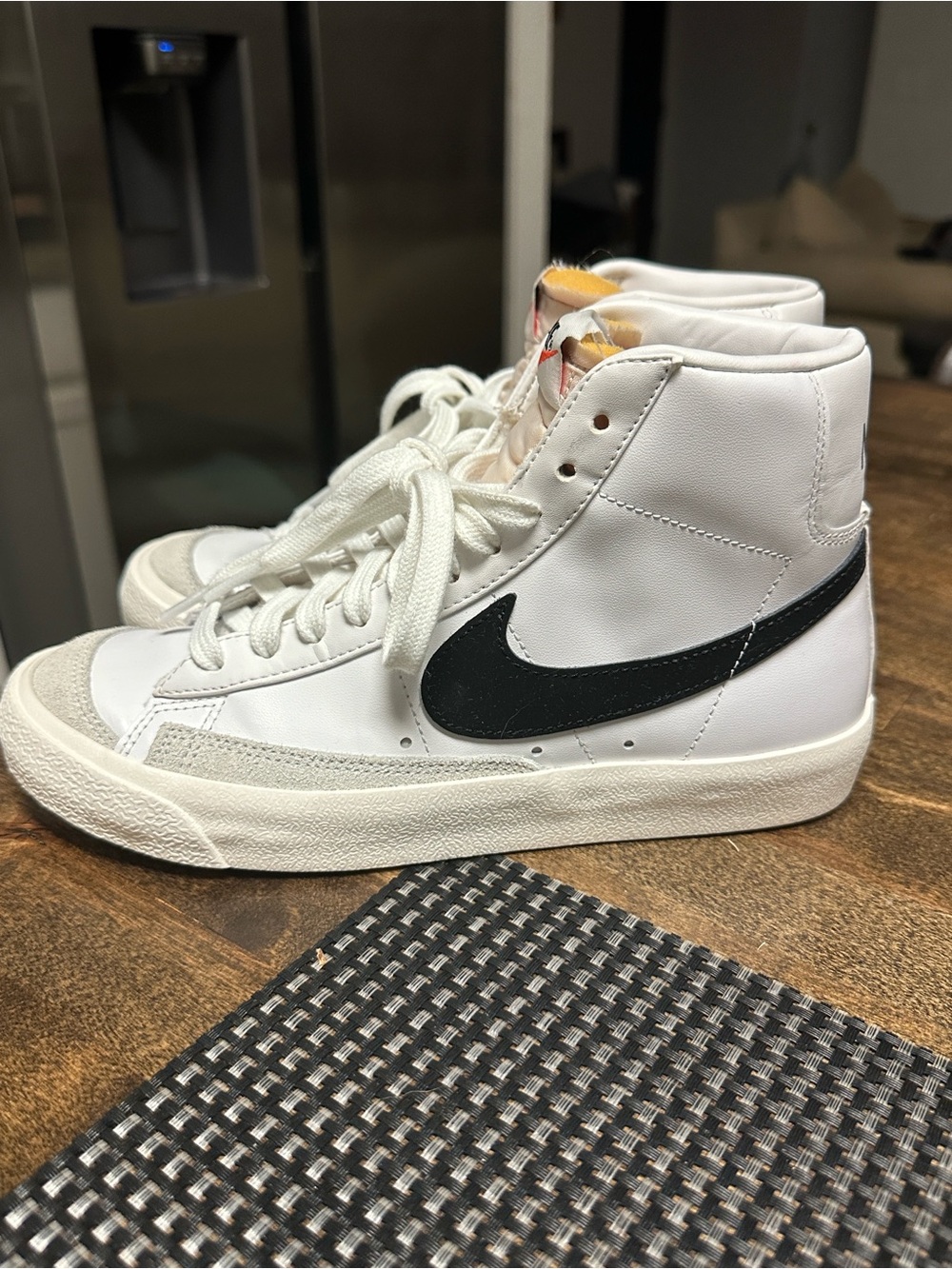 The sneakers in the image are the Nike Blazer Mid '77 Vintage in the classic